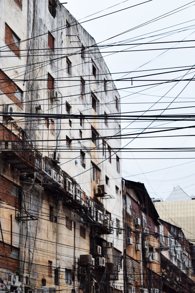 electricity cables crossing buildings in ciudad del este, paraguay